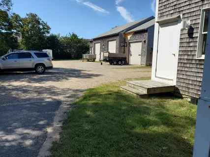 a view of a car parked in front of a house