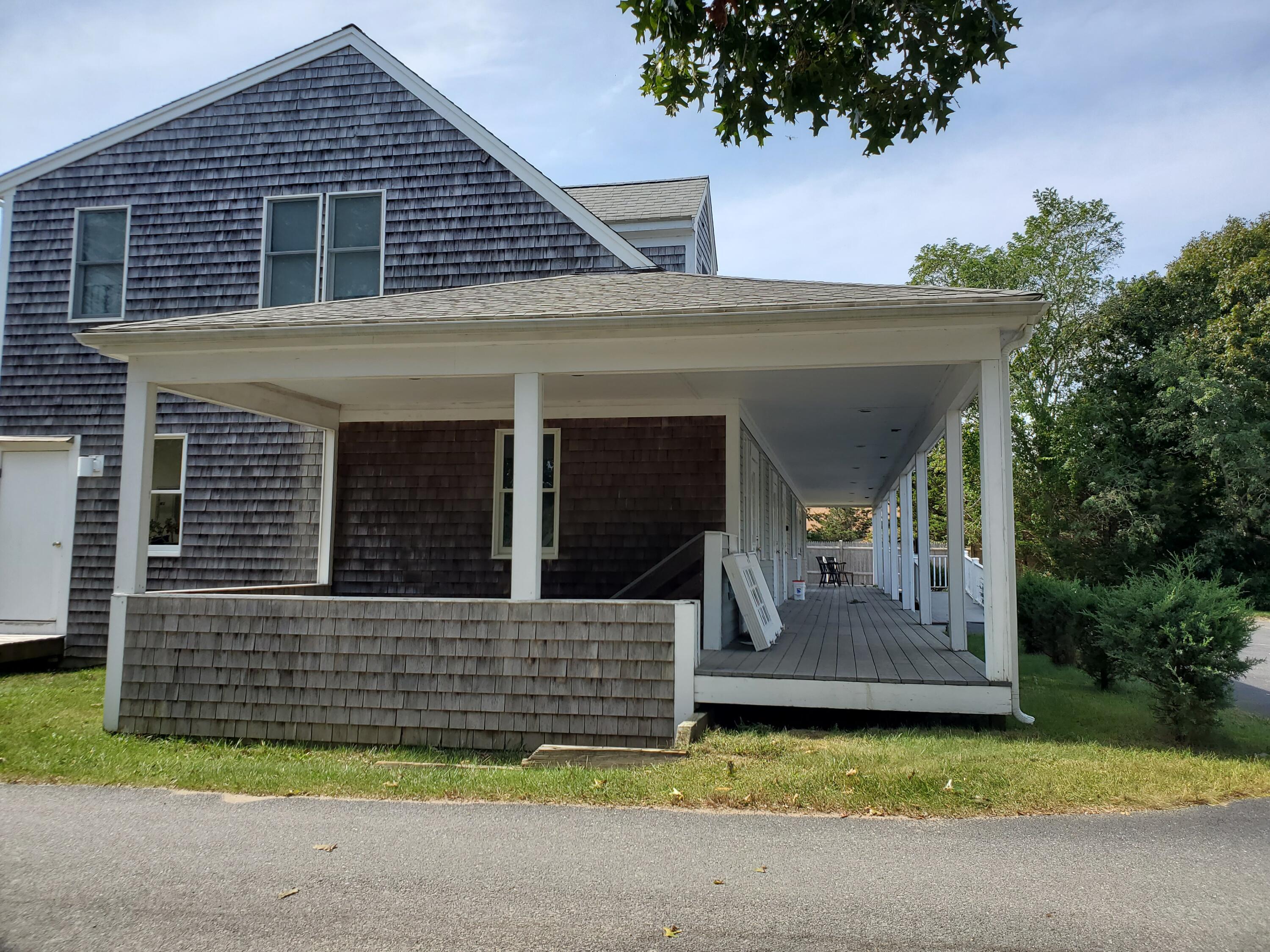 35 Brittany's Way Eastham, MA 02642 - Photo 24 of 30 a front view of a house with garage