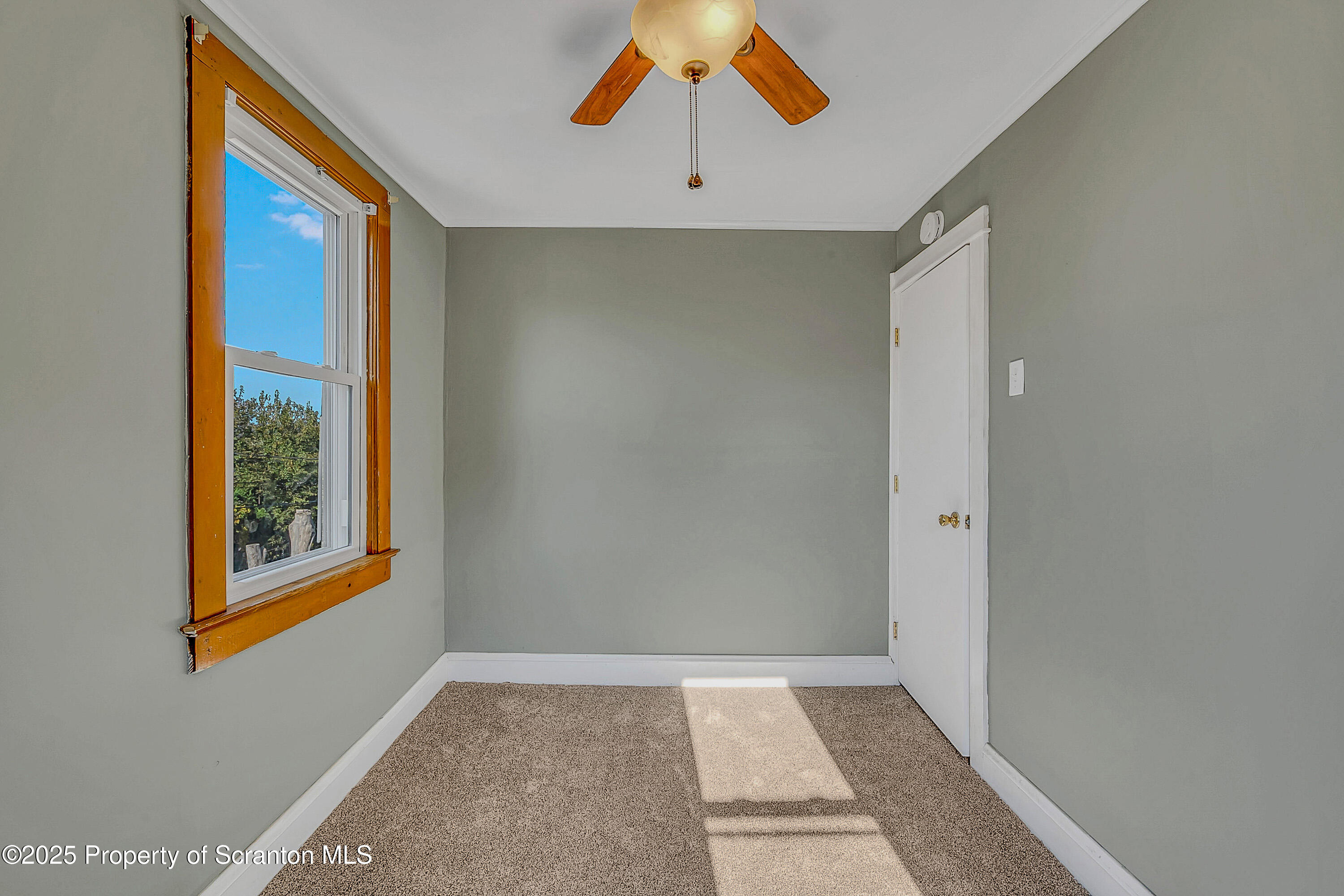 1202 North Webster Avenue, Unit REAR Dunmore, PA 18510 - Photo 1 of 21 a view of an empty room with window and closet