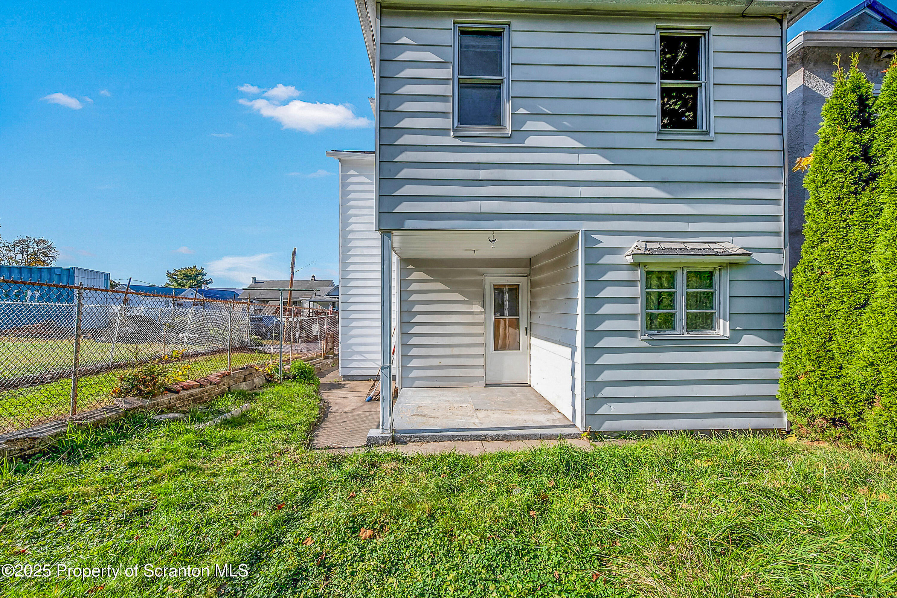 1202 North Webster Avenue, Unit REAR Dunmore, PA 18510 - Photo 11 of 21 a front view of a house with garden