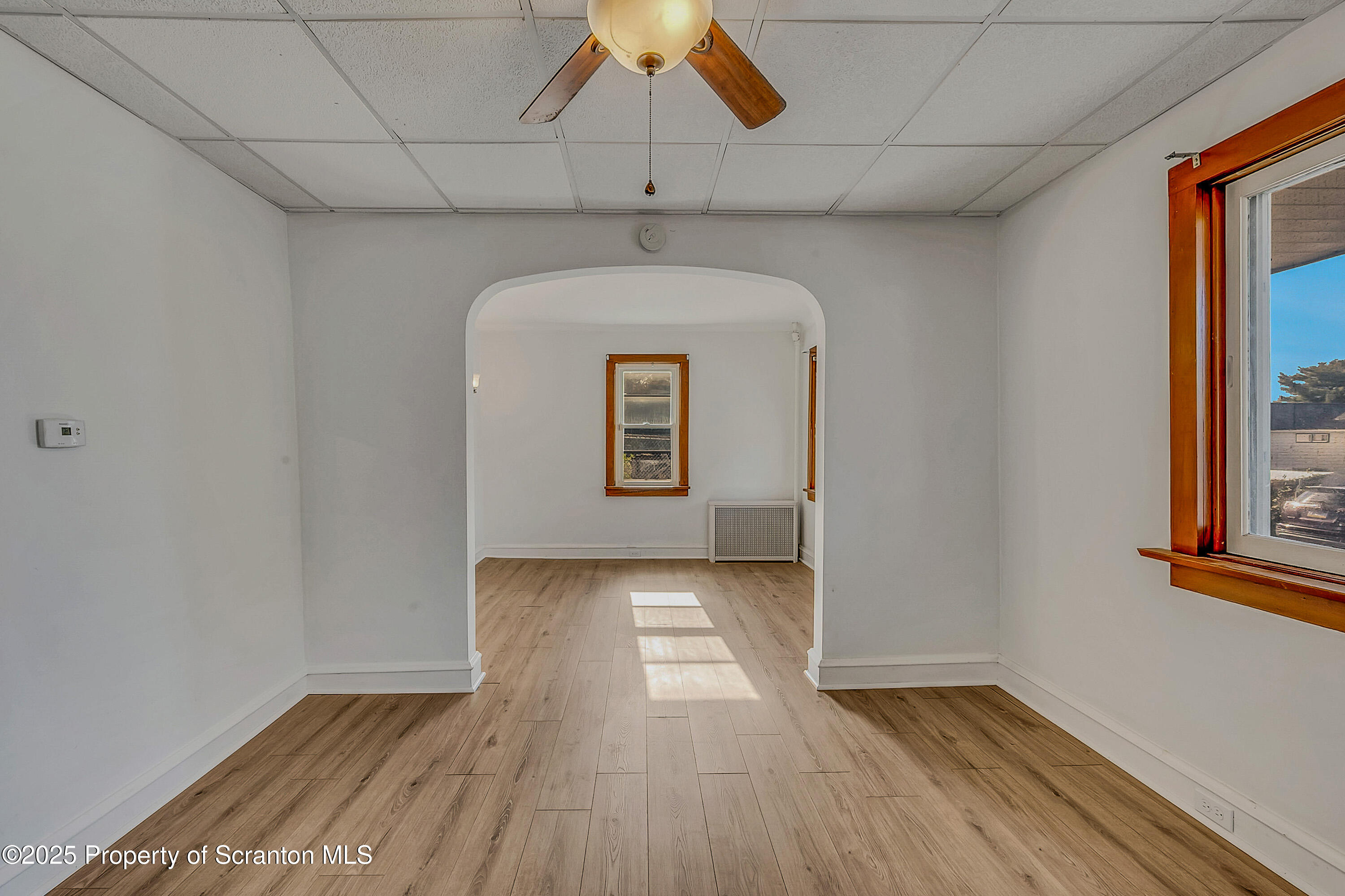 1202 North Webster Avenue, Unit REAR Dunmore, PA 18510 - Photo 16 of 21 a view of a hallway with wooden floor and a window