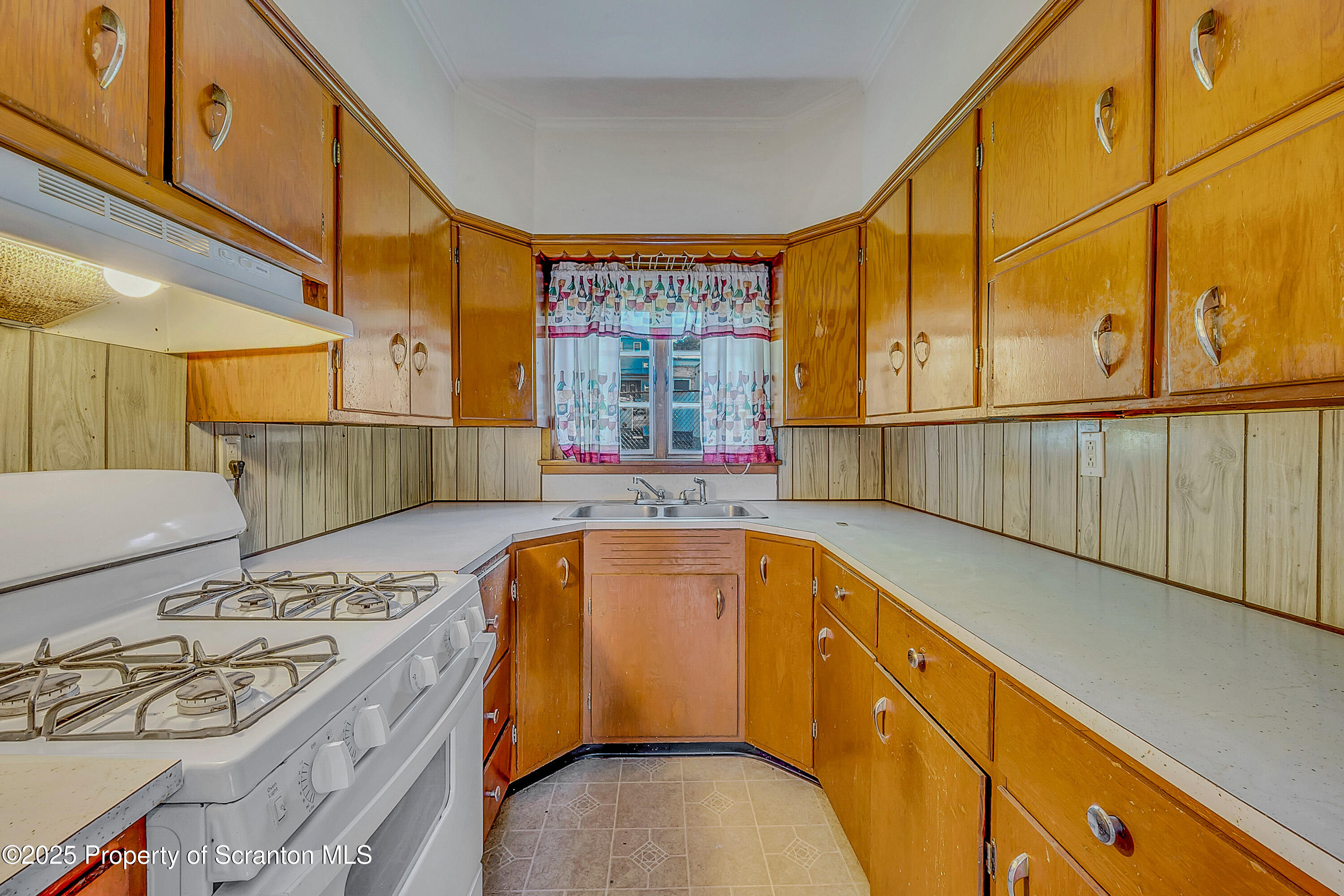 1202 North Webster Avenue, Unit REAR Dunmore, PA 18510 - Photo 18 of 21 a view of a kitchen with a sink and furniture