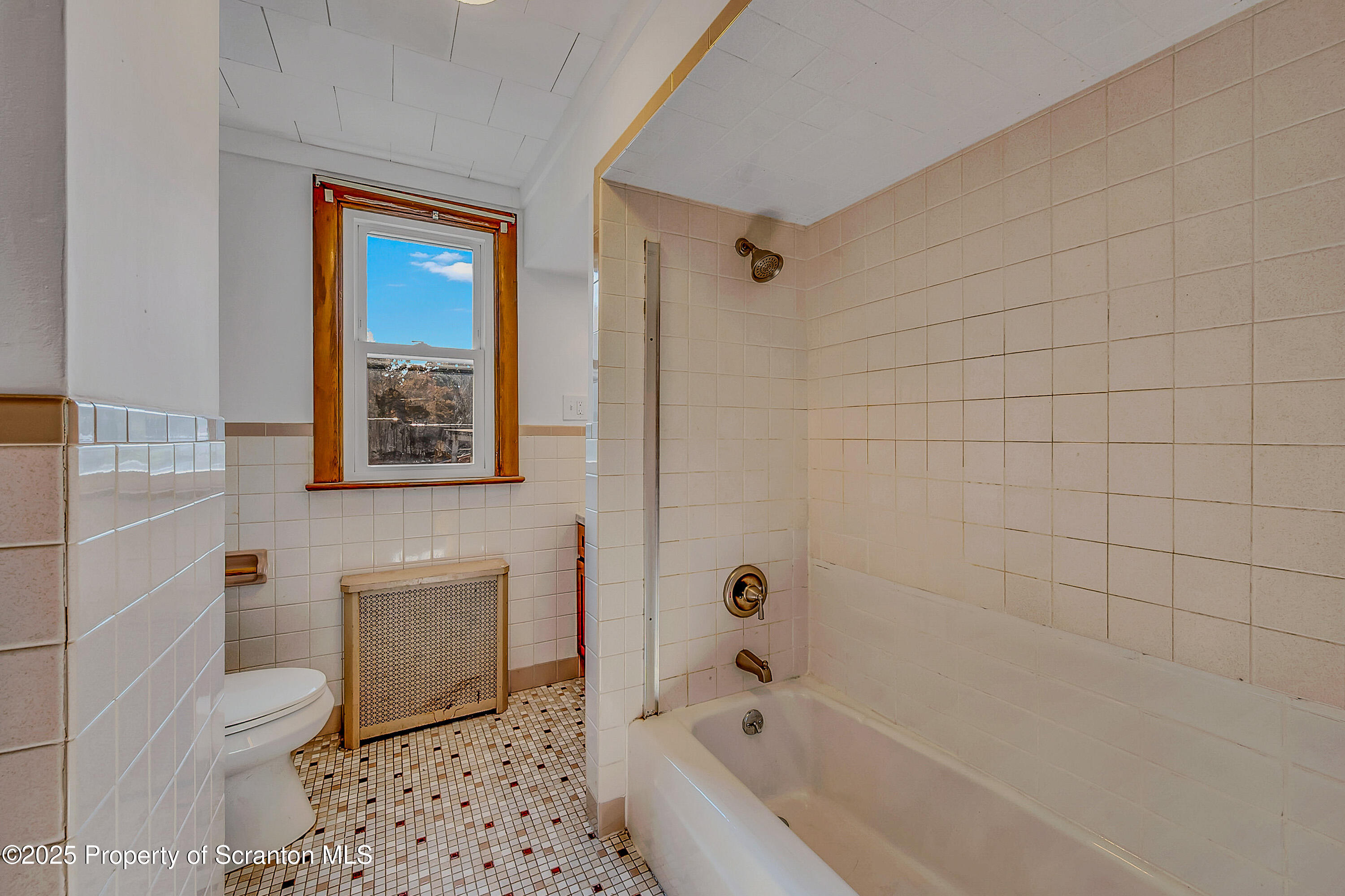 1202 North Webster Avenue, Unit REAR Dunmore, PA 18510 - Photo 6 of 21 a bathroom with a bathtub toilet and shower