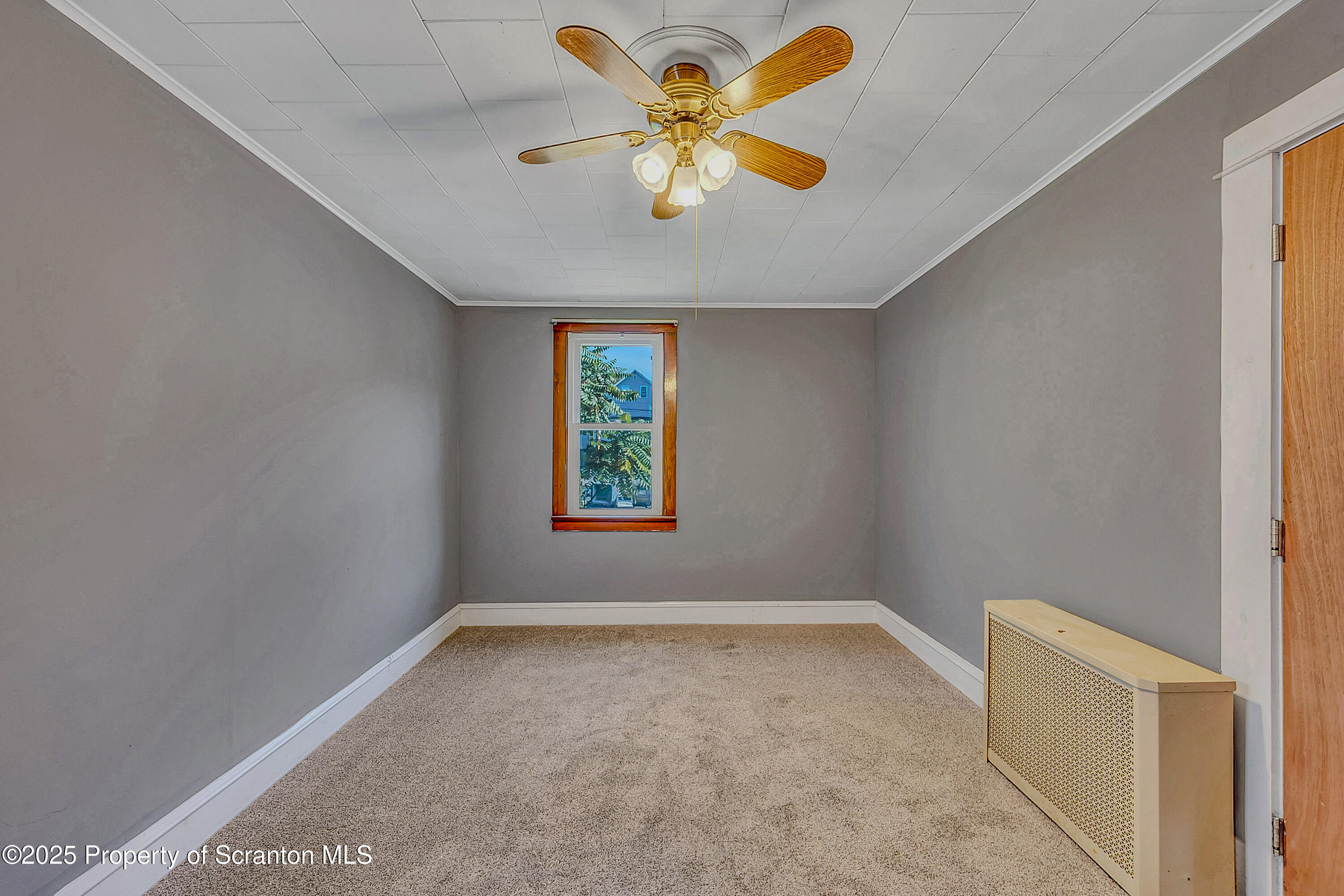1202 North Webster Avenue, Unit REAR Dunmore, PA 18510 - Photo 7 of 21 a view of an empty room with a window