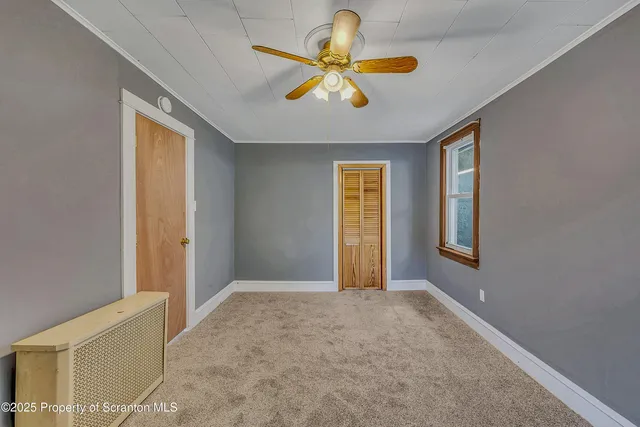 a view of an empty room and window