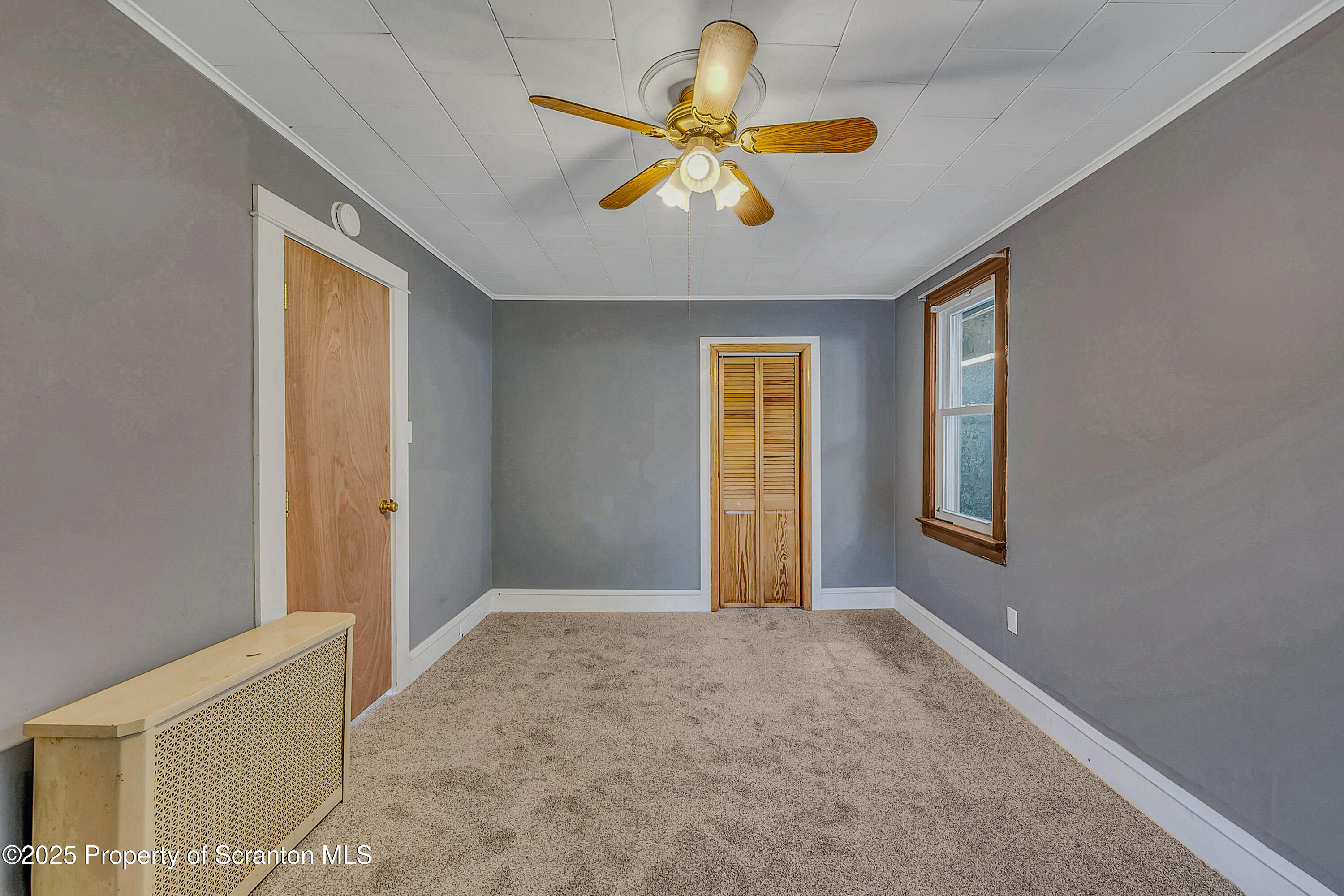 1202 North Webster Avenue, Unit REAR Dunmore, PA 18510 - Photo 8 of 21 a view of an empty room and window