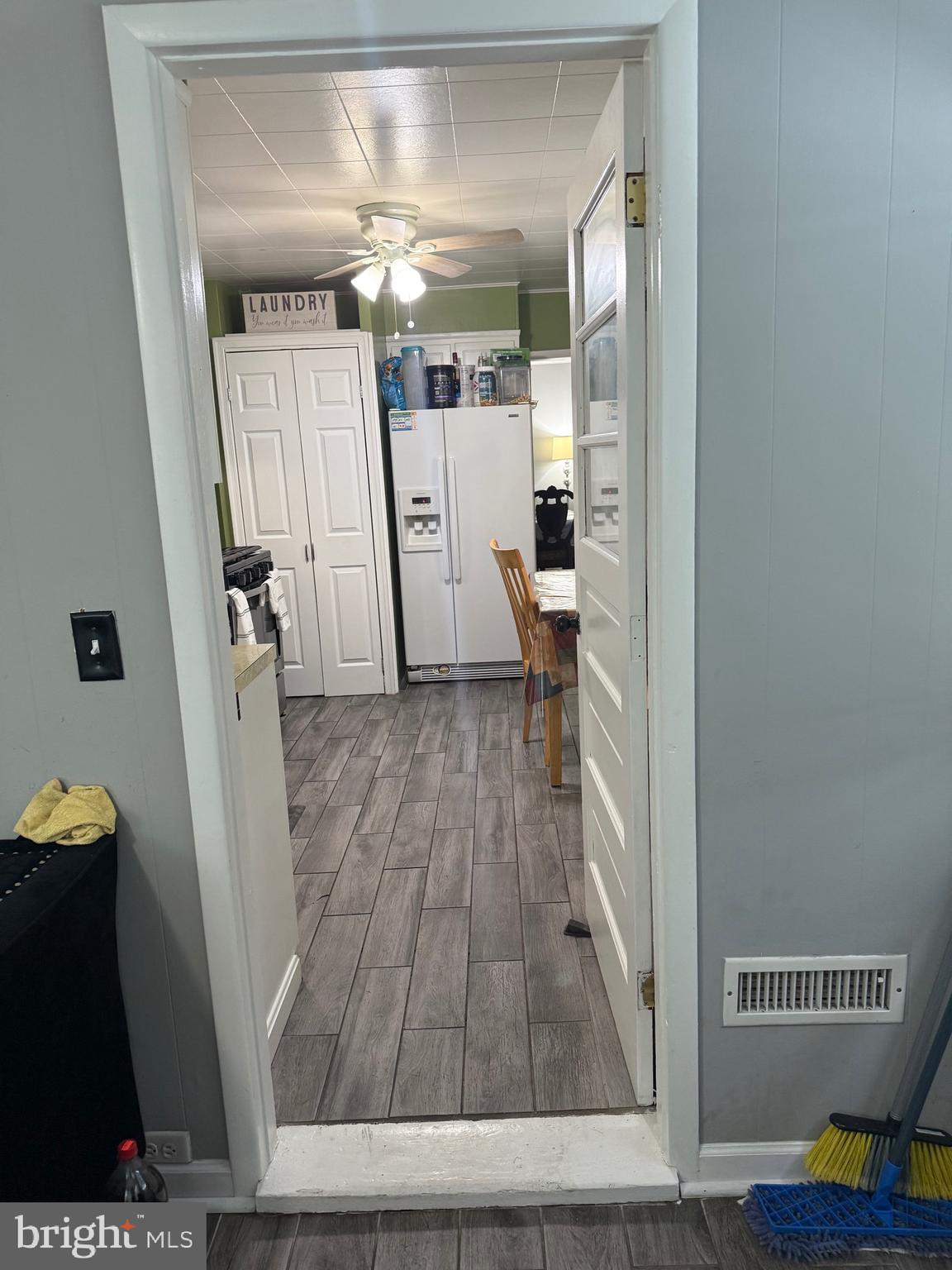 1346 Willow Road Baltimore, MD 21222 - Photo 23 of 81 a view of a hallway with wooden floor and staircase