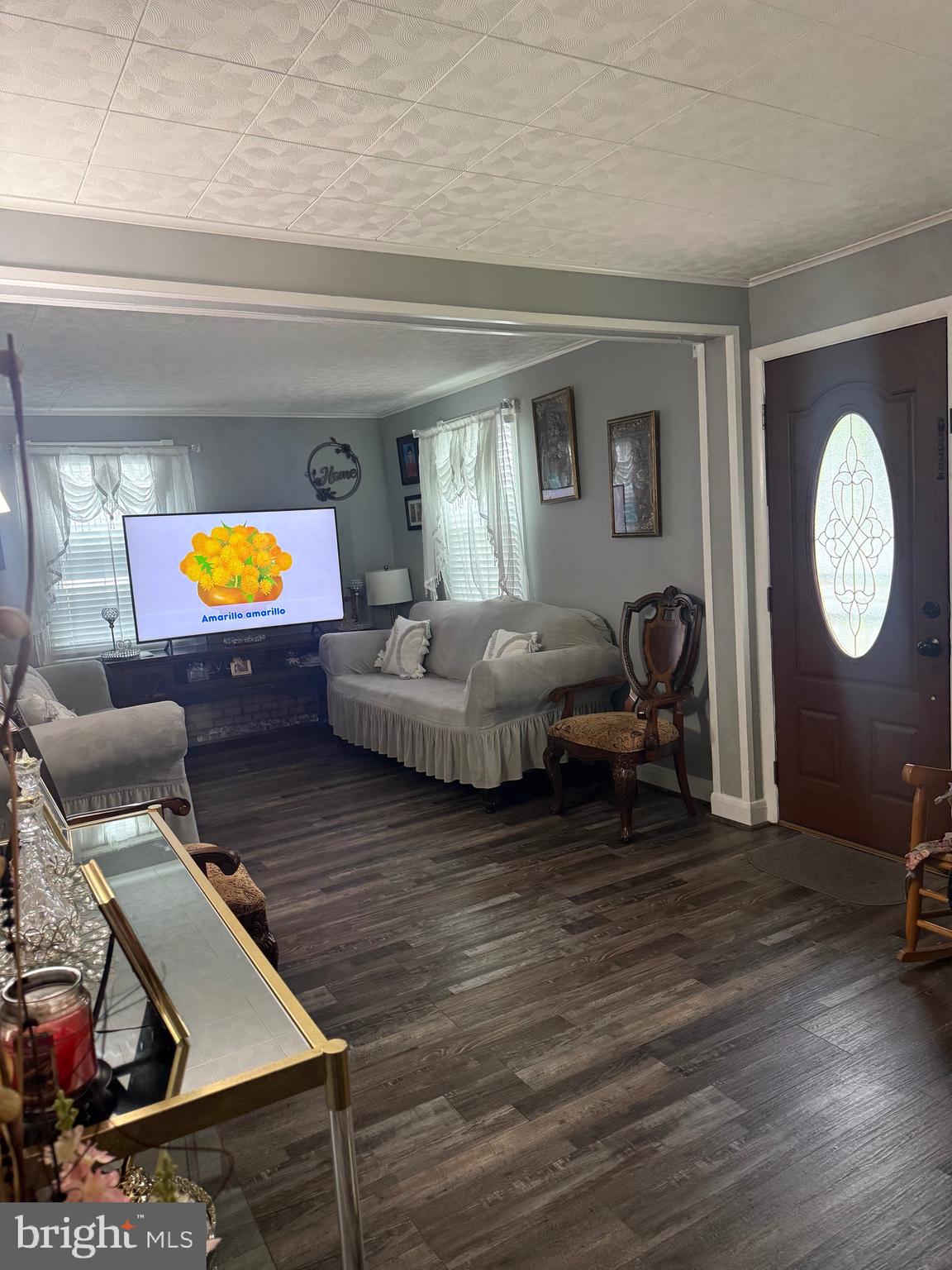 1346 Willow Road Baltimore, MD 21222 - Photo 61 of 81 a living room with furniture and a clock