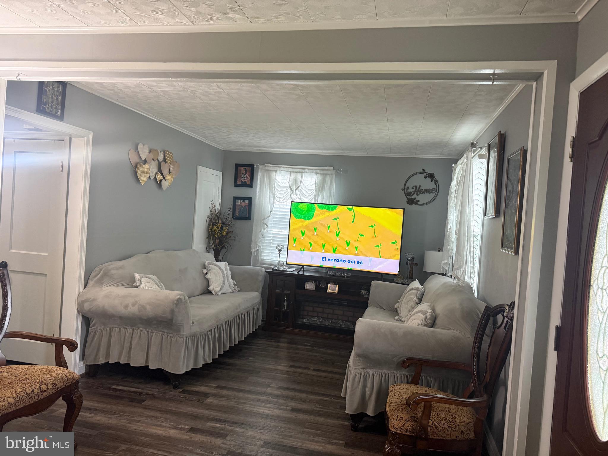 1346 Willow Road Baltimore, MD 21222 - Photo 62 of 81 a living room with furniture and a flat screen tv