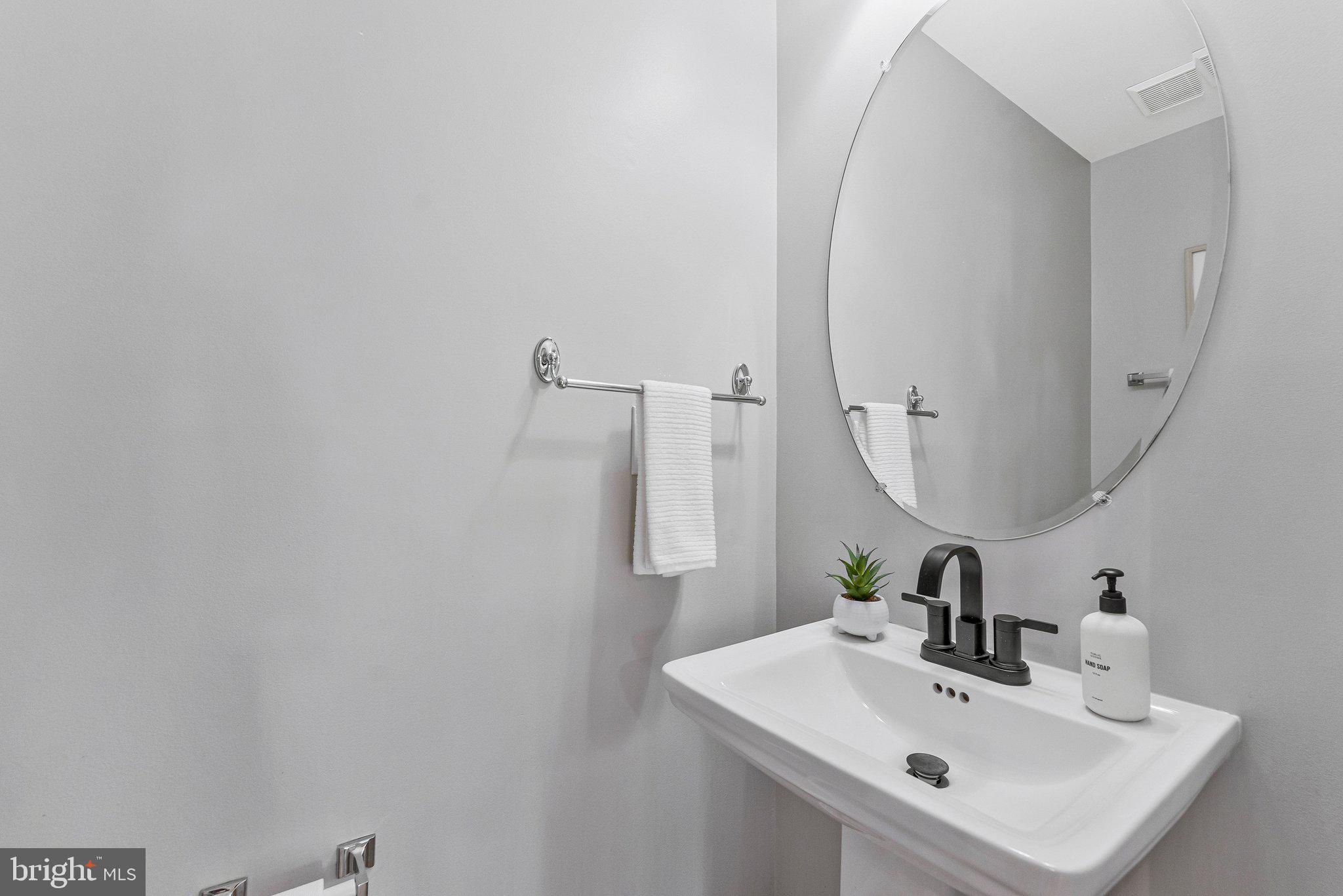 2000 Gallows Tree Lane Vienna, VA 22182 - Photo 20 of 58 a bathroom with a sink and a mirror