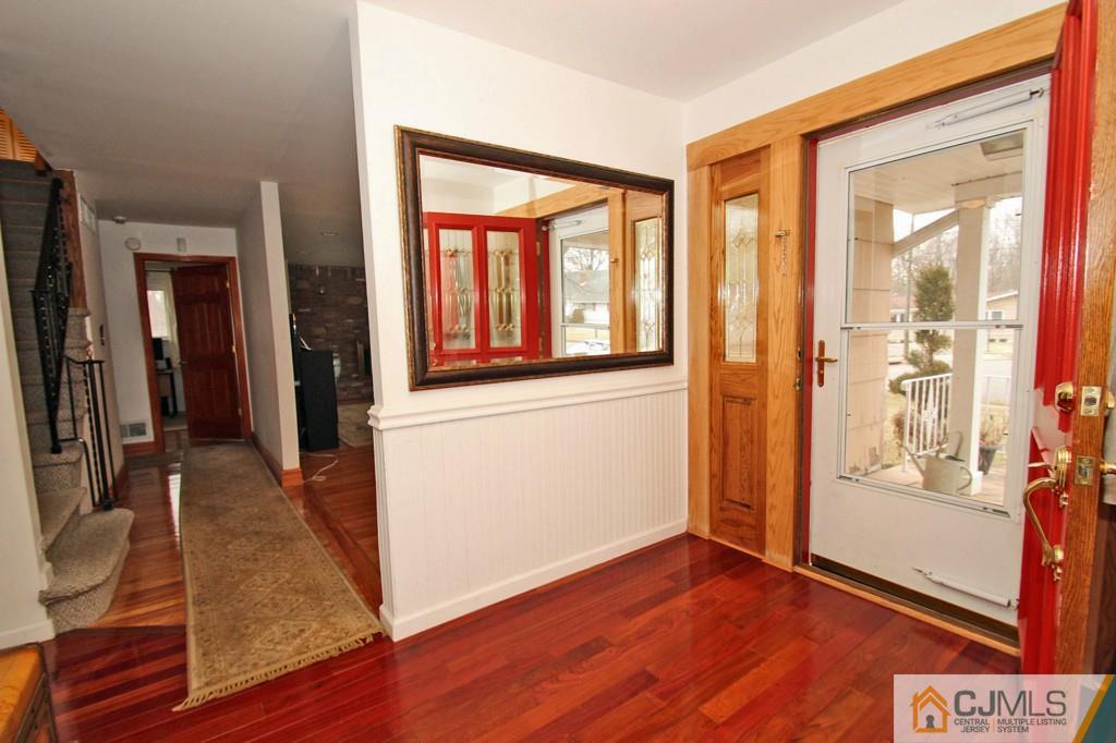 32 Timber Road Edison, NJ 08820 - Photo 2 of 25 wooden floor in an empty room with a window