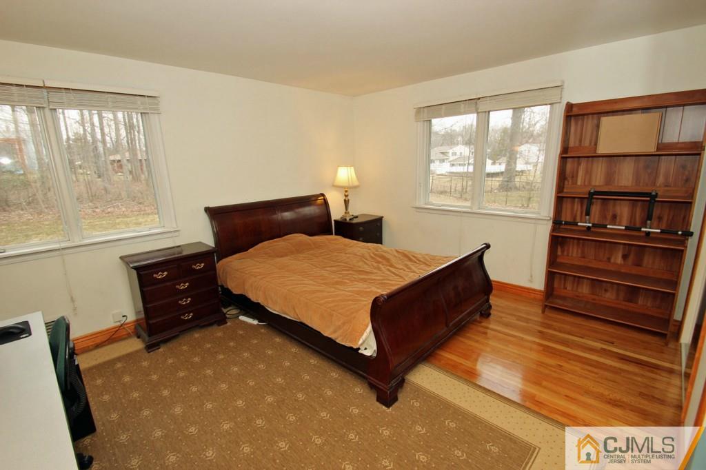 32 Timber Road Edison, NJ 08820 - Photo 14 of 25 a bed room with a bed and a window