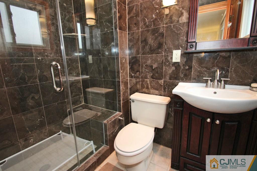 32 Timber Road Edison, NJ 08820 - Photo 20 of 25 a bathroom with a sink toilet and shower