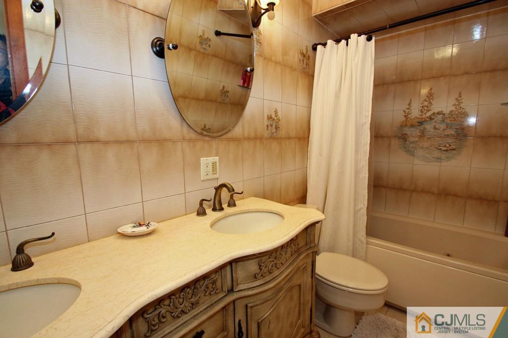 32 Timber Road Edison, NJ 08820 - Photo 21 of 25 a bathroom with a sink and a mirror