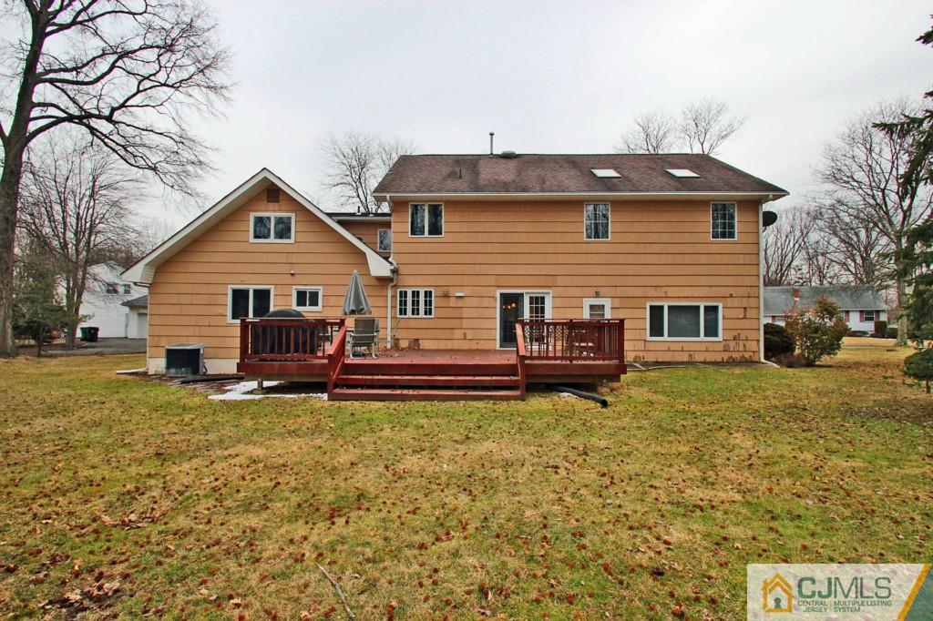 32 Timber Road Edison, NJ 08820 - Photo 24 of 25 a view of a house with a chairs in a patio
