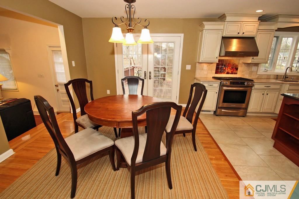 32 Timber Road Edison, NJ 08820 - Photo 7 of 25 a view of a dining room with furniture and wooden floor