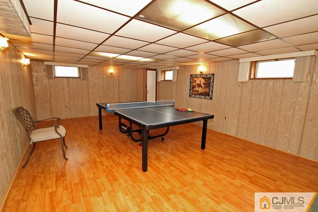 32 Timber Road Edison, NJ 08820 - Photo 9 of 25 a living room with a table tennis pool table and chairs