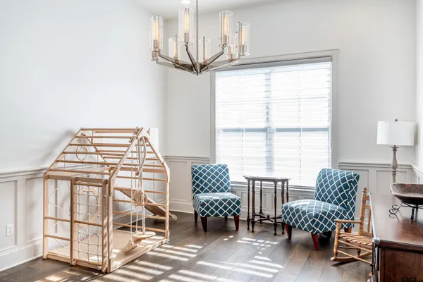 a bedroom with furniture and windows