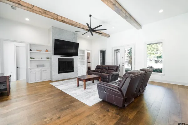 a view of living room kitchen island furniture and fireplace