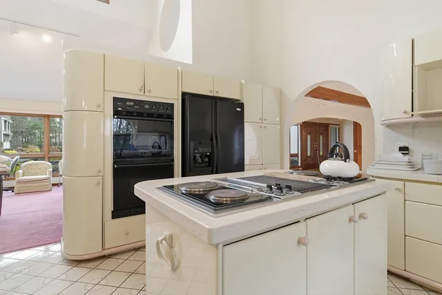 a kitchen with stainless steel appliances granite countertop a refrigerator sink and cabinets