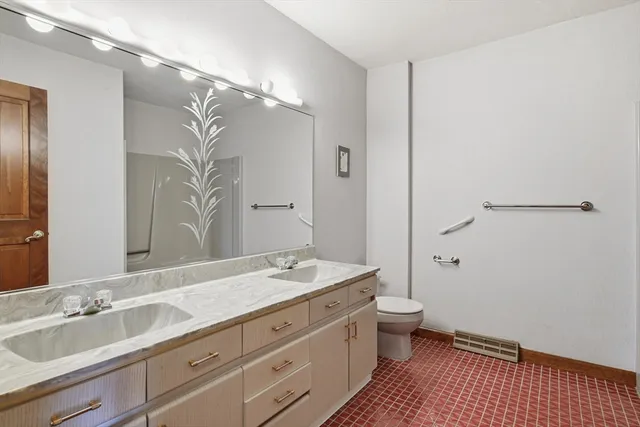 a view of bathroom with a sink mirror and toilet