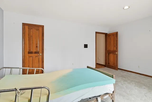 an empty room with closet area