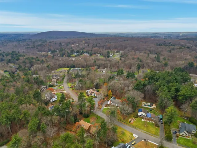 a aerial view of a house with a yard