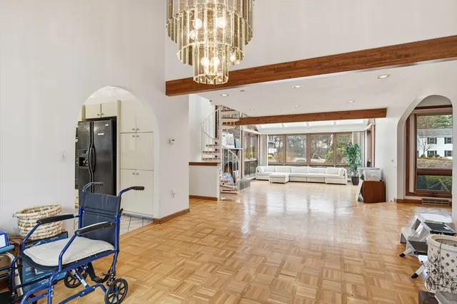 a view of a lobby with furniture and a chandelier