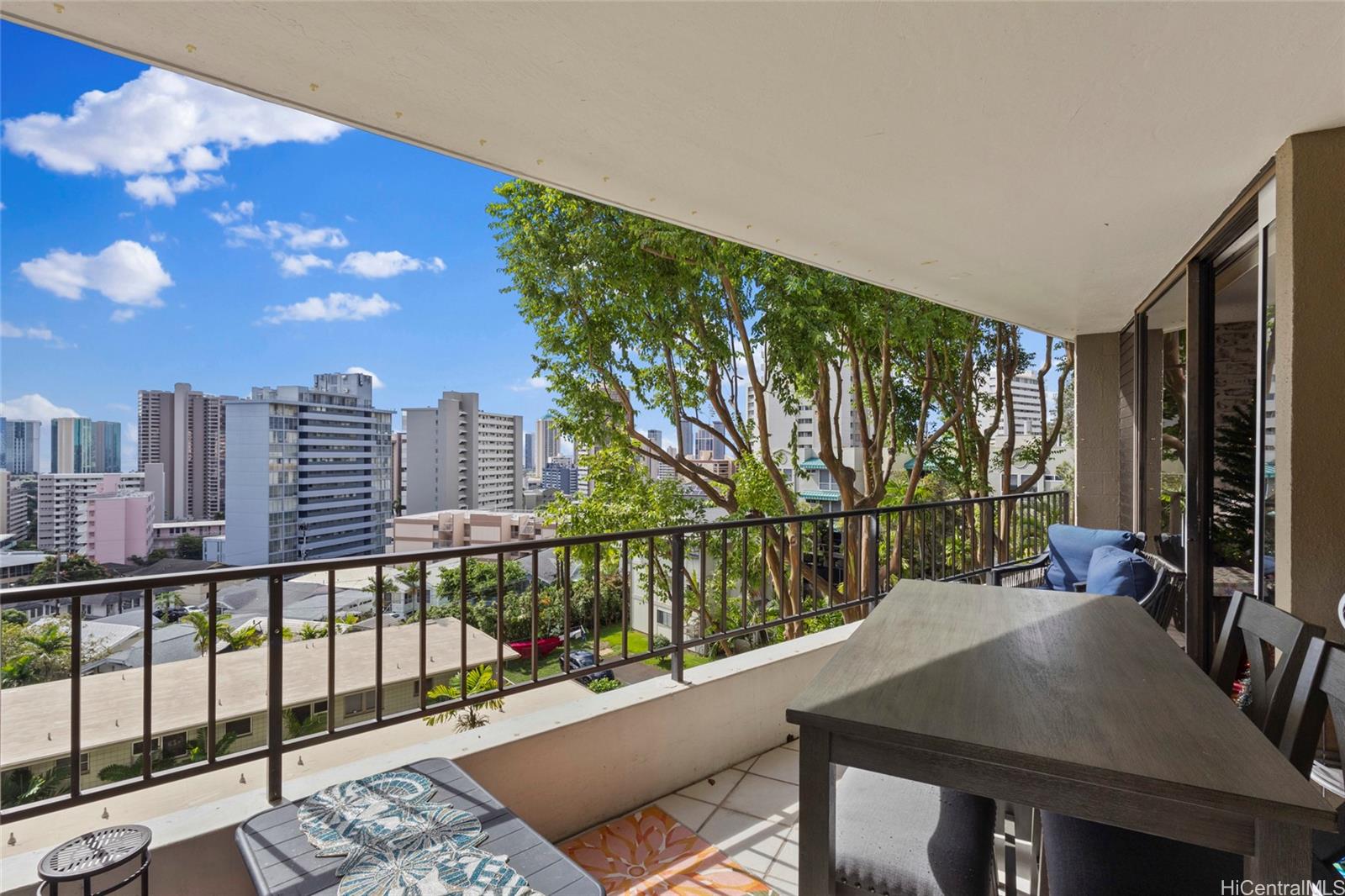 965 Prospect Street, Unit 404 Honolulu, HI 96822 - Photo 14 of 24 a view of a balcony with two chairs and a table
