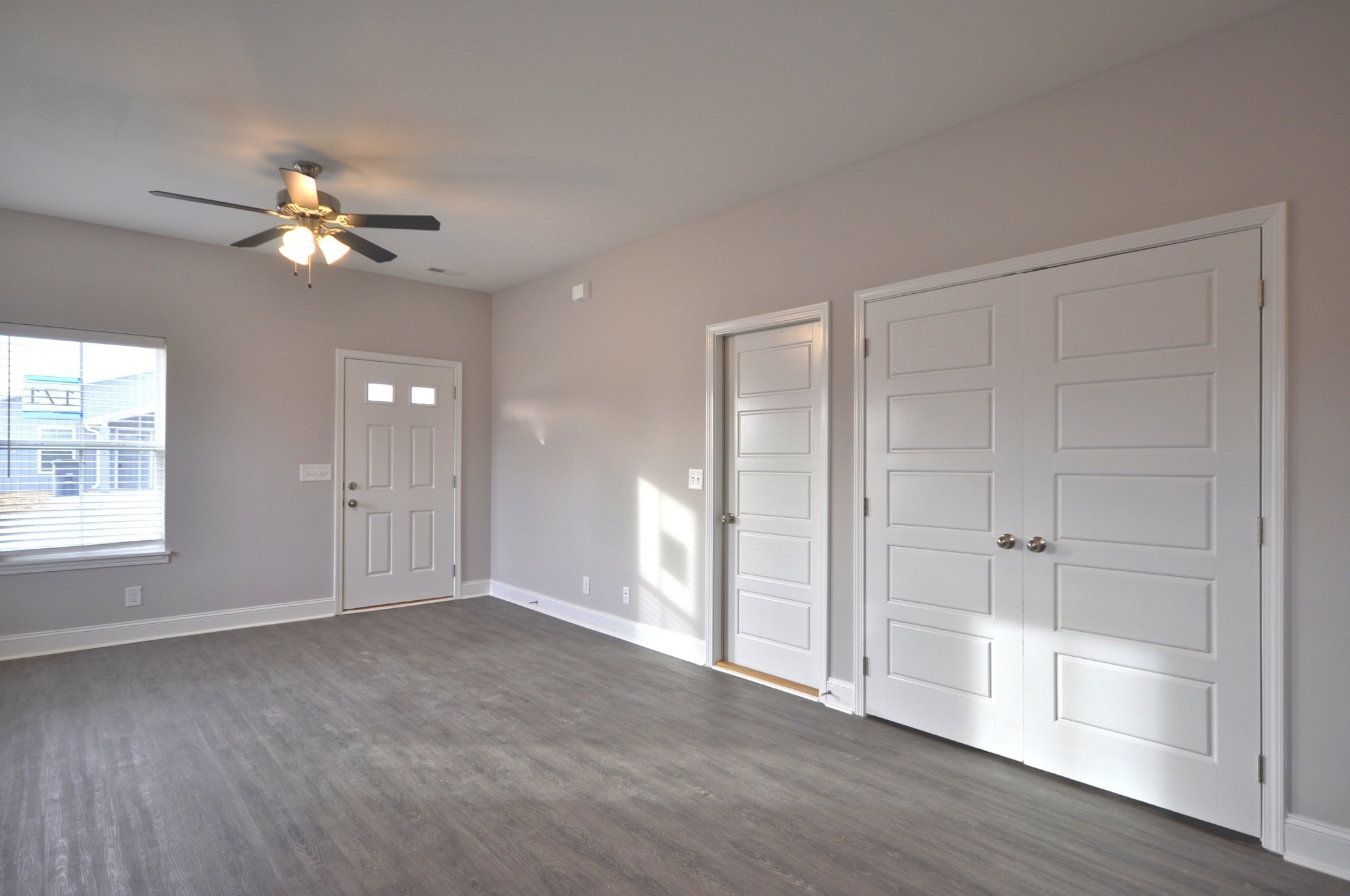 177 Bainbridge Drive, Unit A Clarksville, TN 37043 - Photo 14 of 34 wooden floor in an empty room with a window