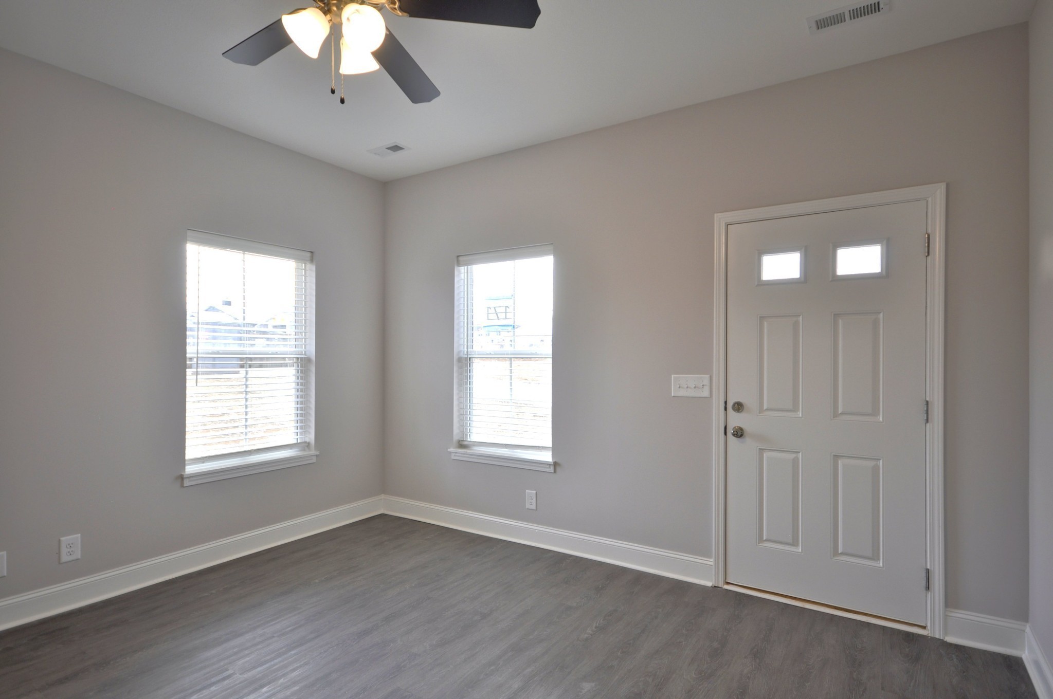 177 Bainbridge Drive, Unit A Clarksville, TN 37043 - Photo 6 of 34 a view of an empty room with a window and wooden floor