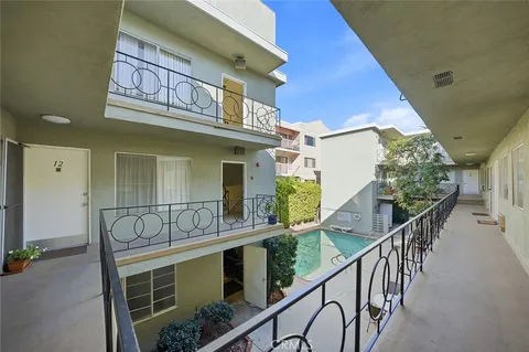 a view of balcony with furniture