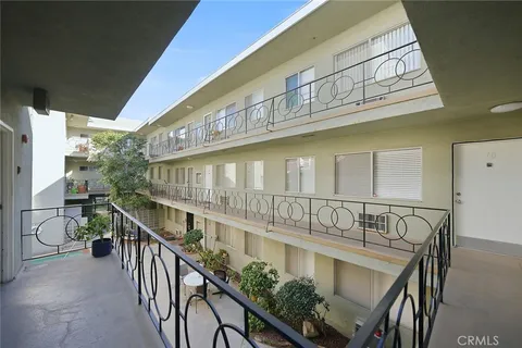 a view of balcony with furniture and wooden deck