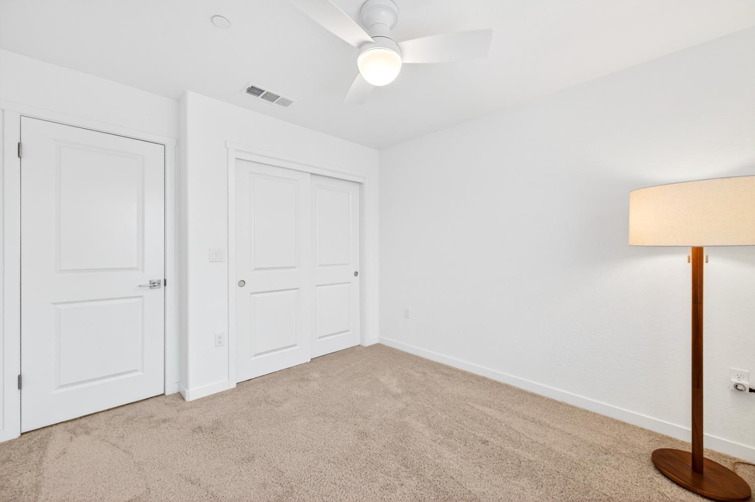 317 Talus Way South Madera, CA 93636 - Photo 41 of 61 an empty room with a ceiling fan