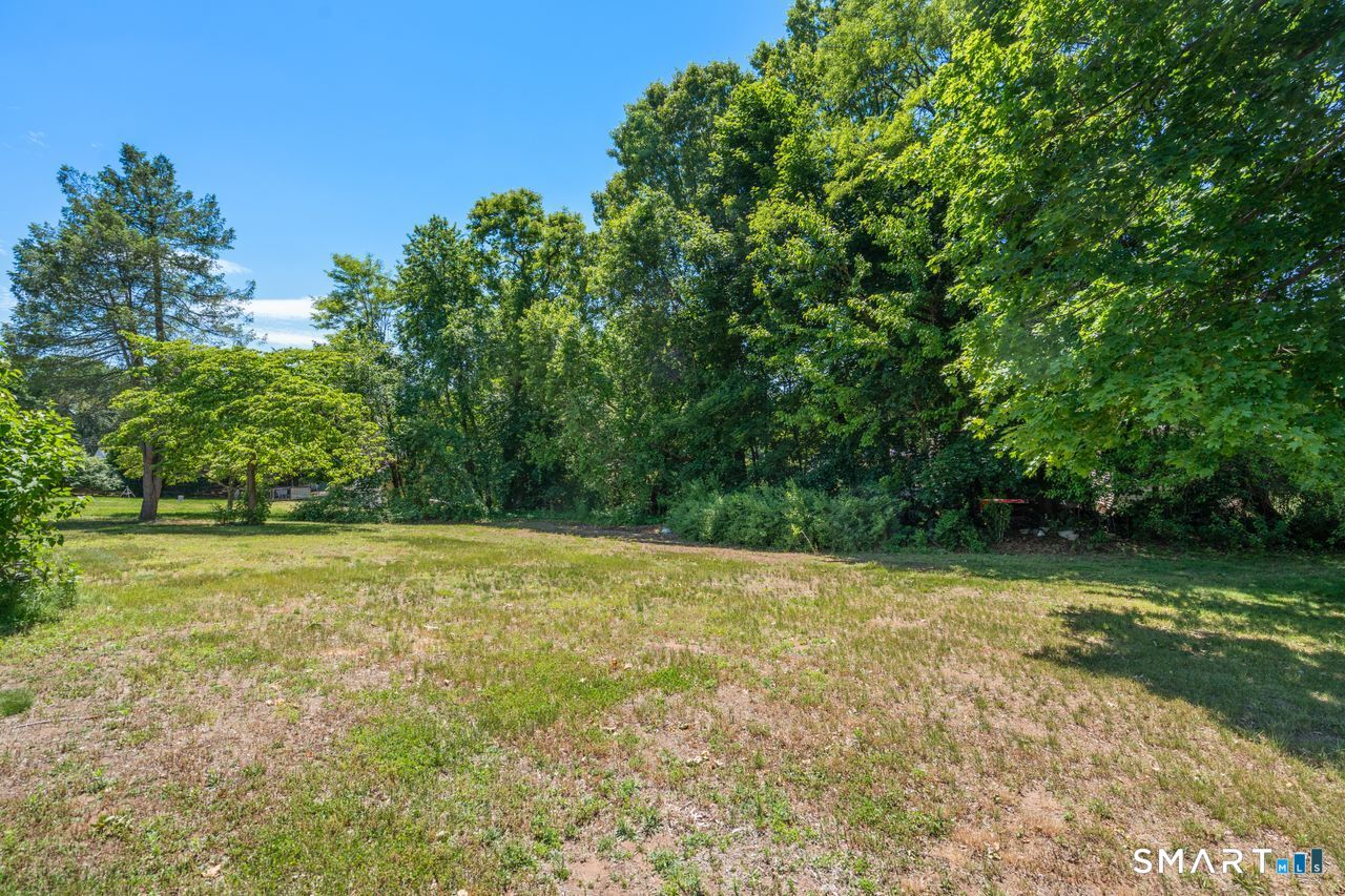 9 Stanton Road North Haven, CT 06473 - Photo 30 of 35 a view of a field with trees in the background