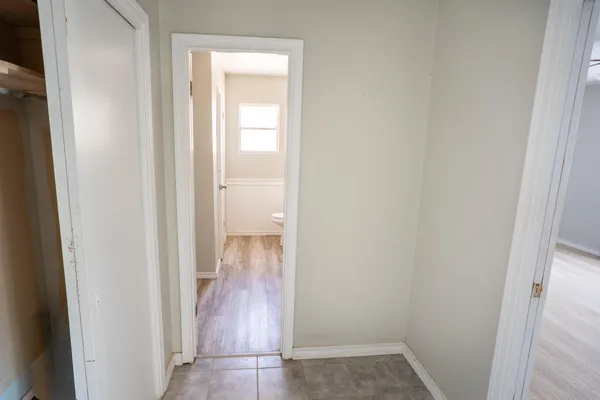 a view of a bathroom from the hallway