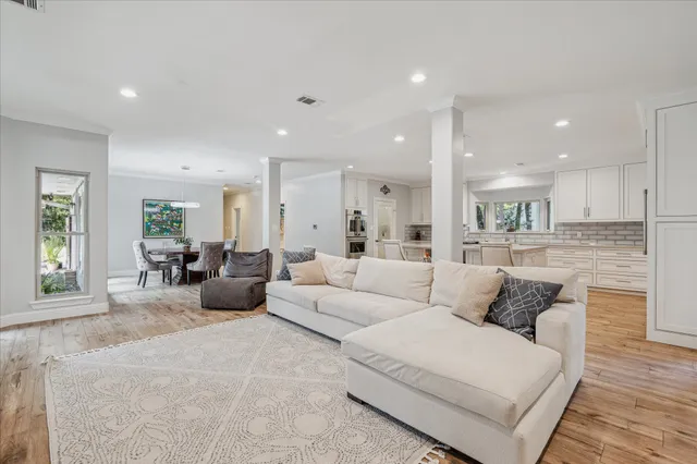 a bathroom with a toilet sink vanity and mirror