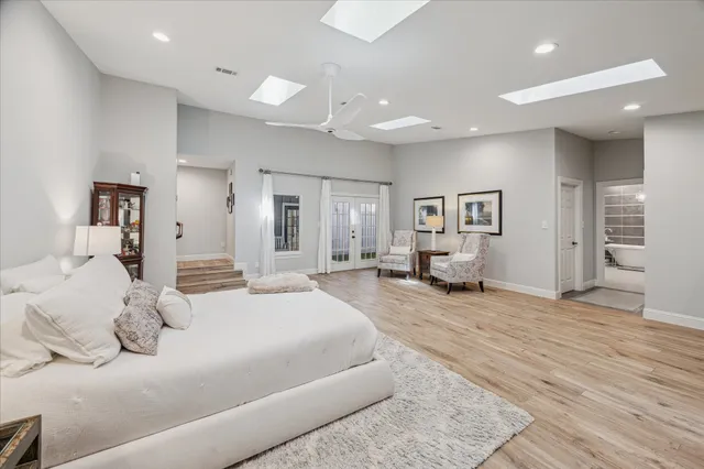 a bedroom with a bed and a cabinets