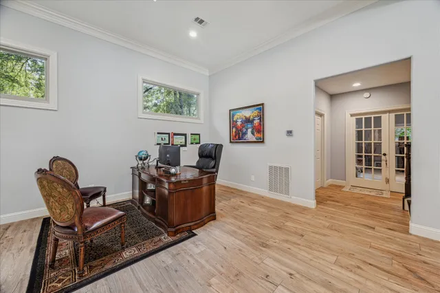 a bedroom with a large bed and a flat screen tv