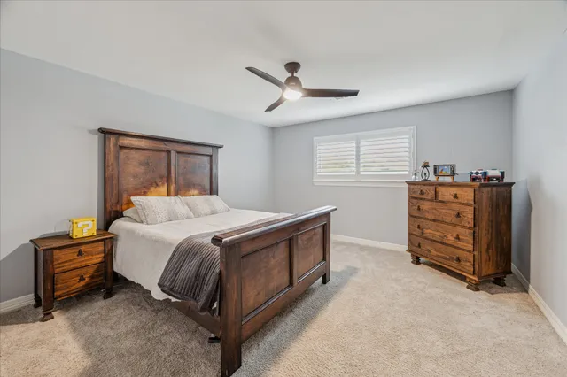 a room with pool table and wooden floor
