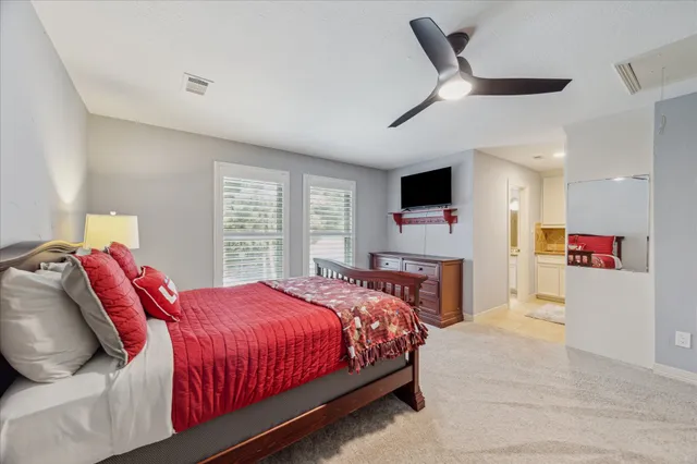 a view of a patio with chairs and table under an umbrella