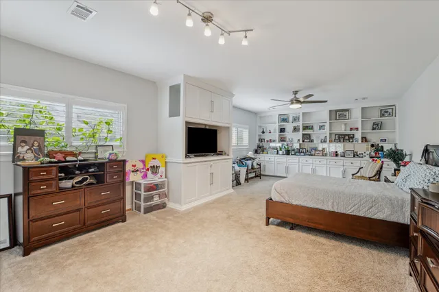 a view of a house with a yard and tree s