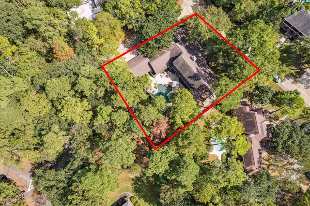 a front view of a bathroom with a sink and a mirror