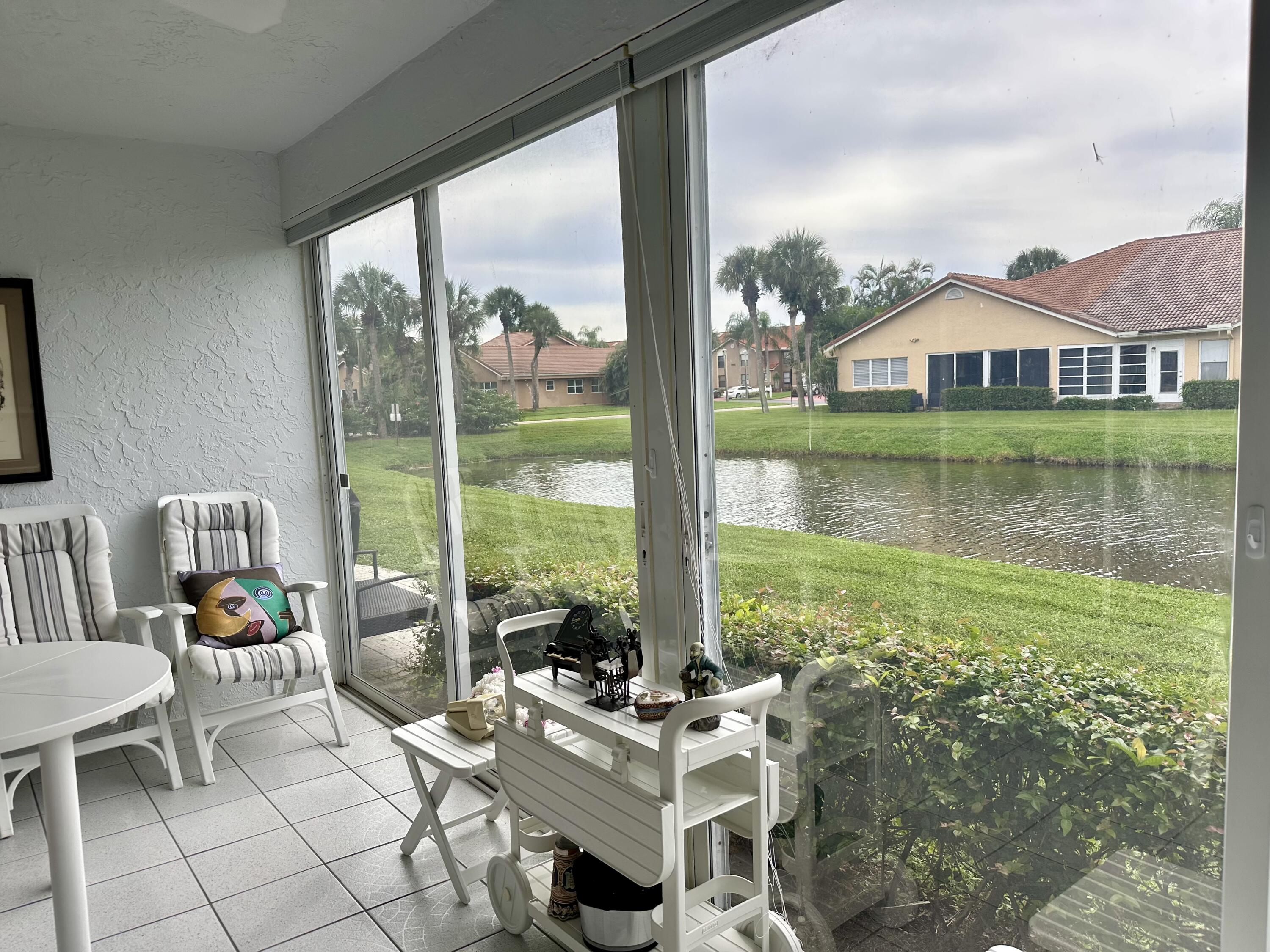 10940 Ladera Lane, Unit C Boca Raton, FL 33498 - Photo 22 of 26 Screened Patio