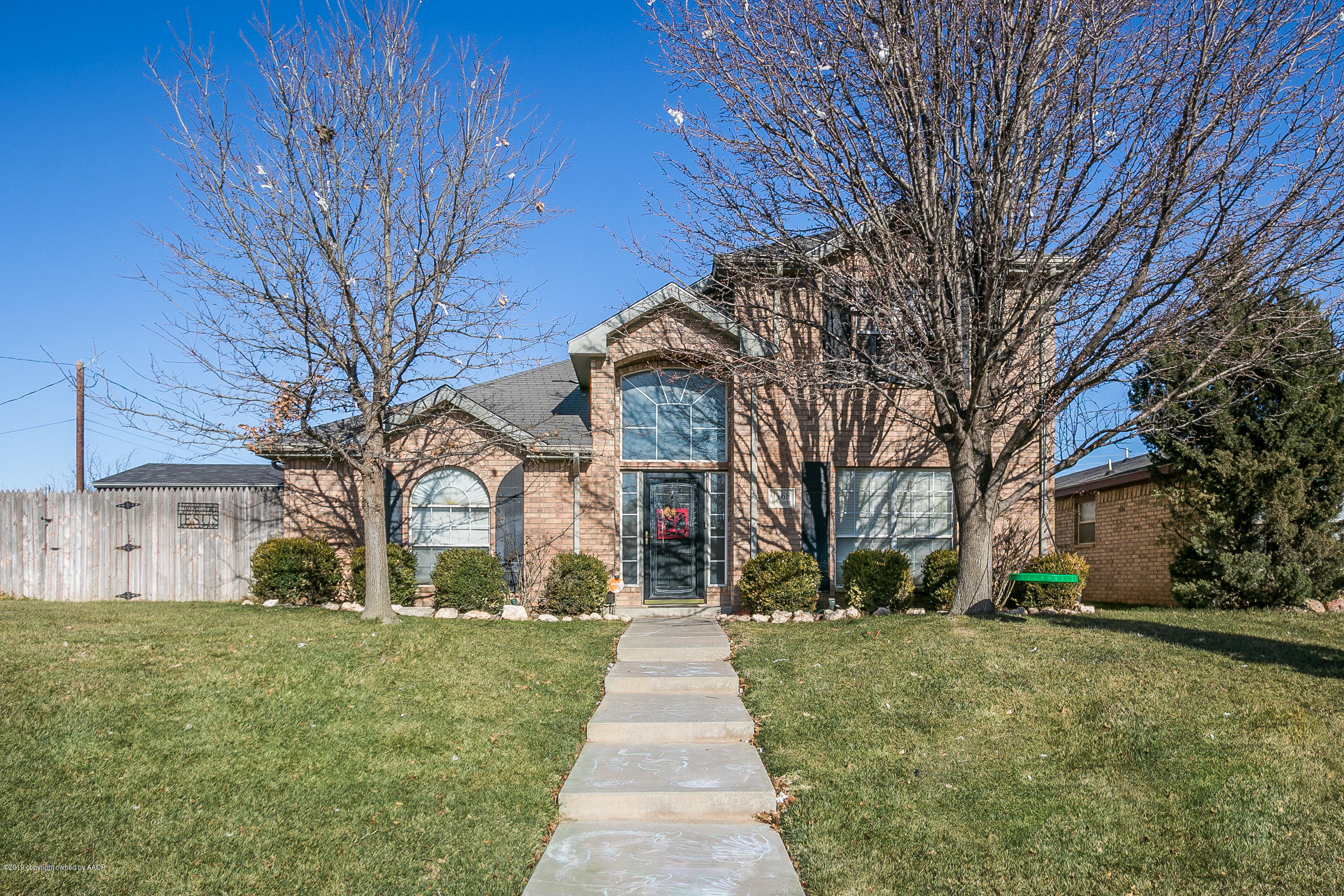 1168 Rushmore Drive Amarillo, TX 79110 - Photo 1 of 25 a front view of a building with garden