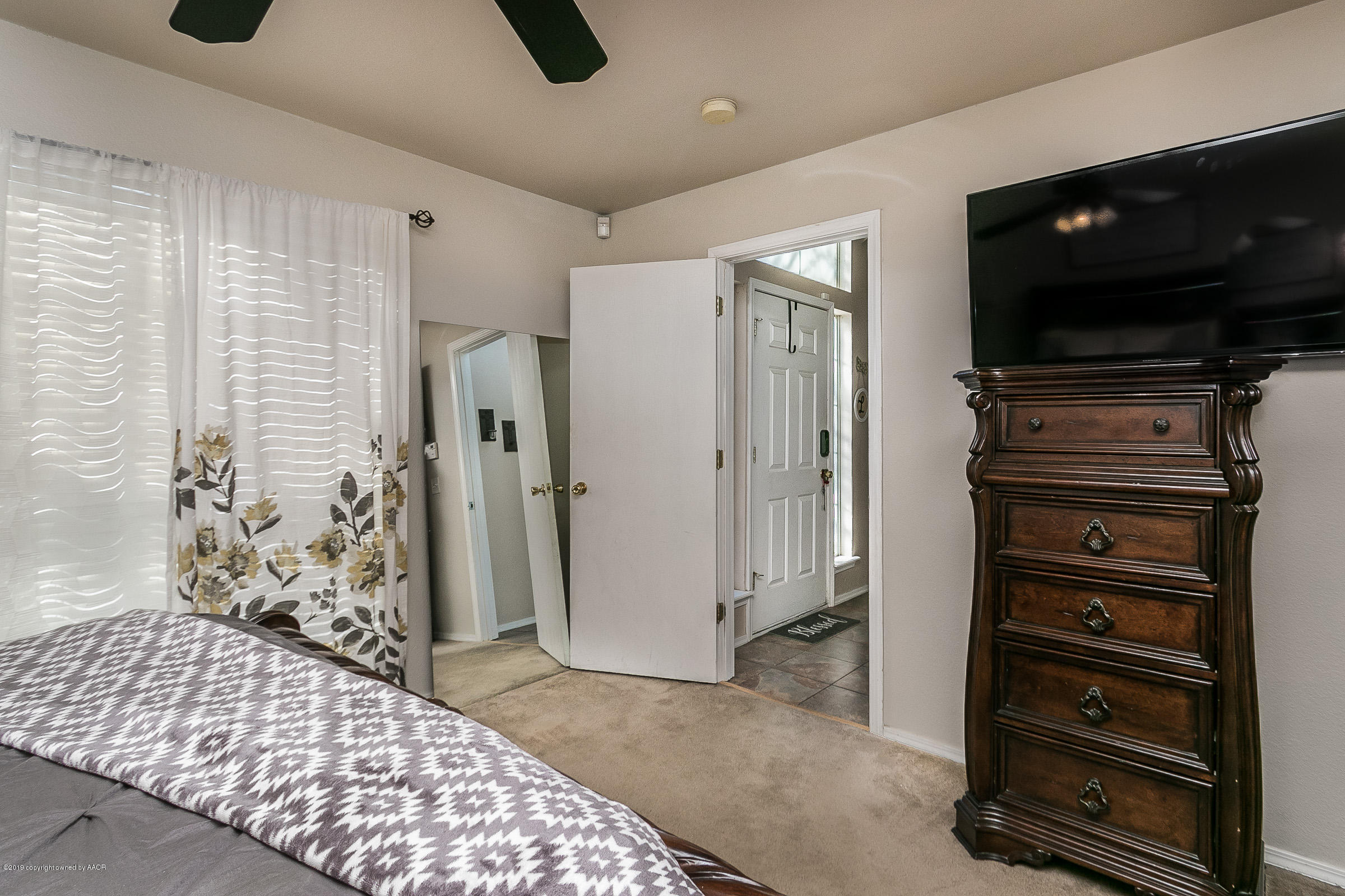 1168 Rushmore Drive Amarillo, TX 79110 - Photo 15 of 25 a bedroom with a bed and a television