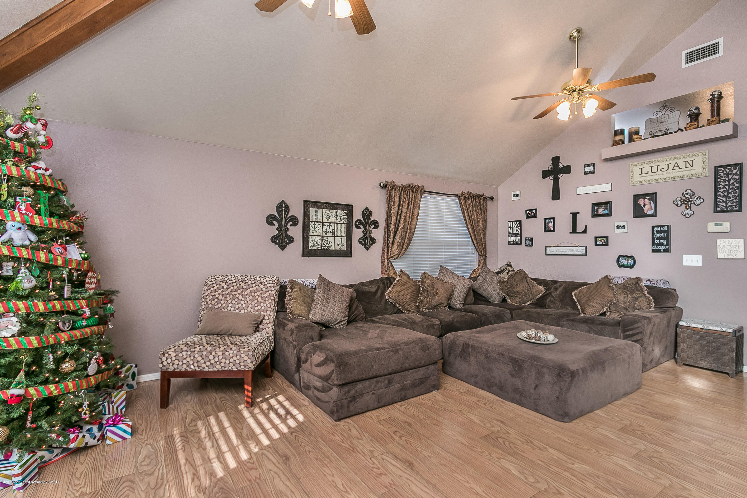 1168 Rushmore Drive Amarillo, TX 79110 - Photo 5 of 25 a living room with furniture and flowers