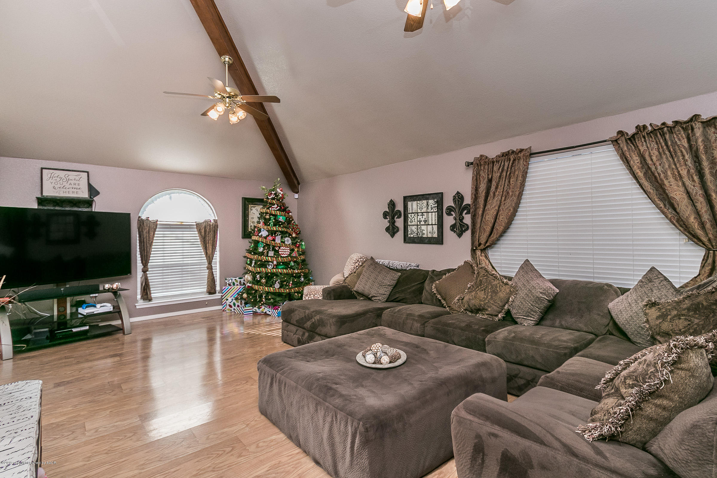 1168 Rushmore Drive Amarillo, TX 79110 - Photo 6 of 25 a living room with furniture and a flat screen tv