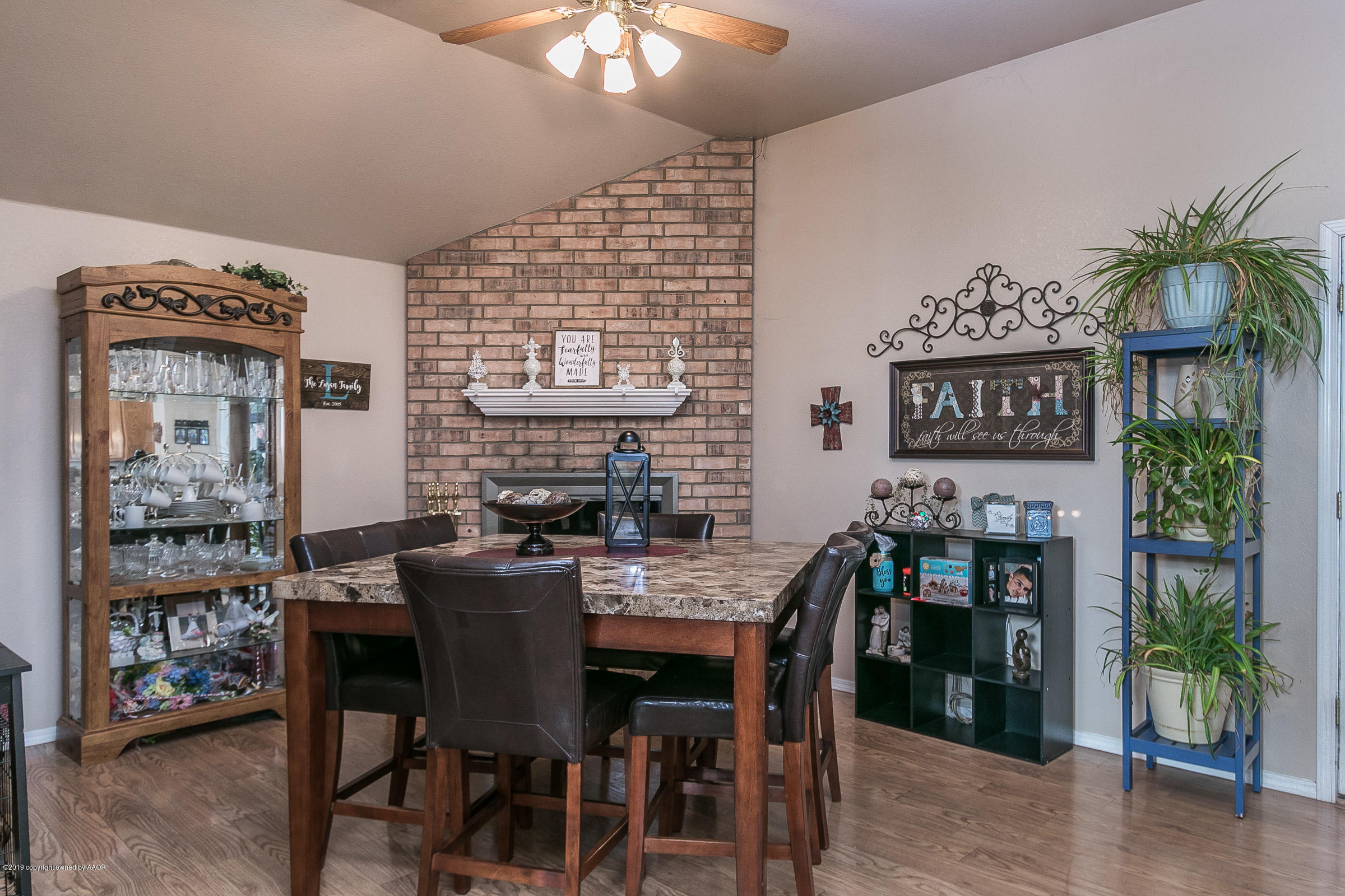 1168 Rushmore Drive Amarillo, TX 79110 - Photo 7 of 25 a view of a dining room with furniture and chandelier