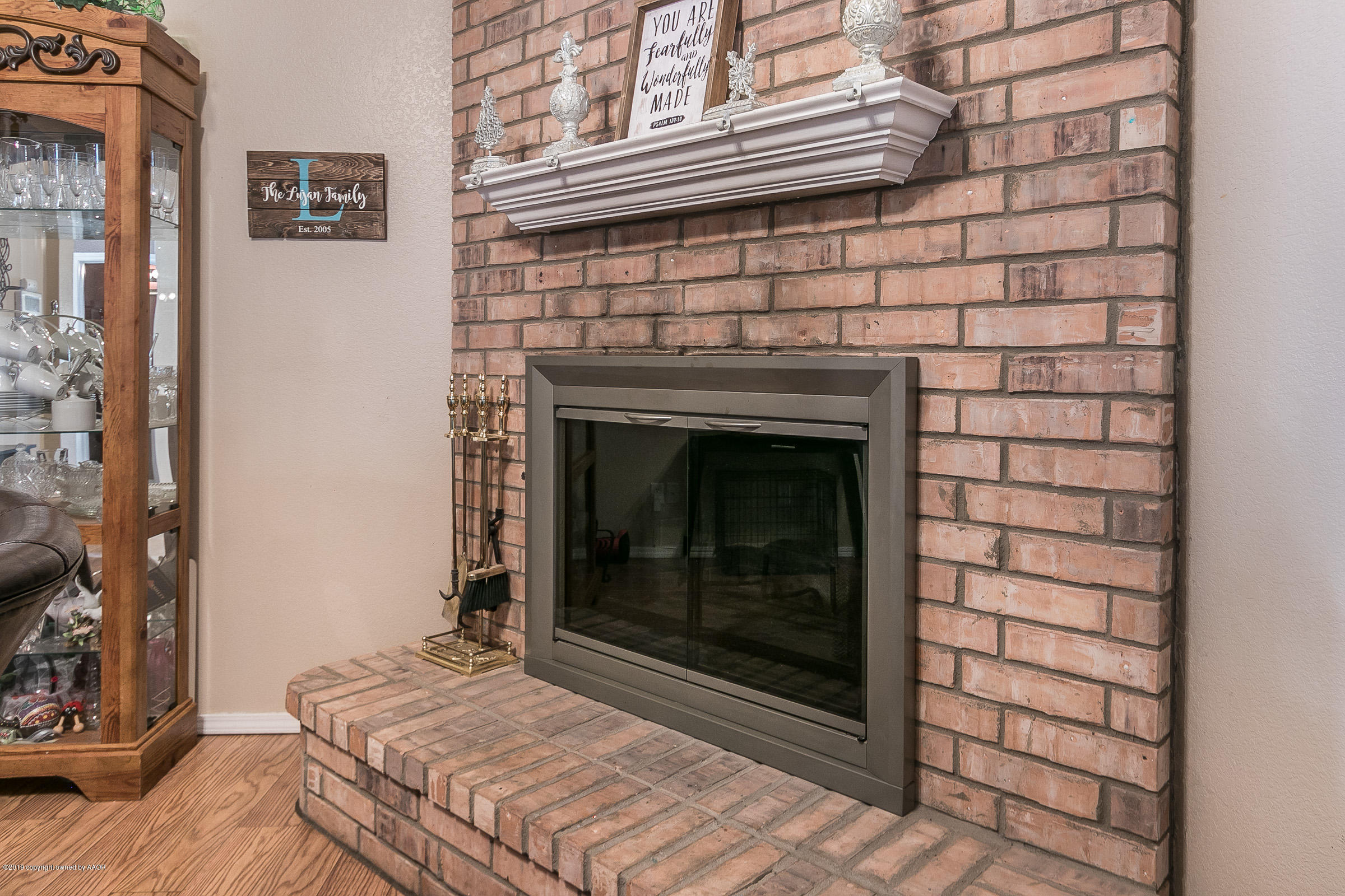 1168 Rushmore Drive Amarillo, TX 79110 - Photo 8 of 25 a bedroom with a fireplace
